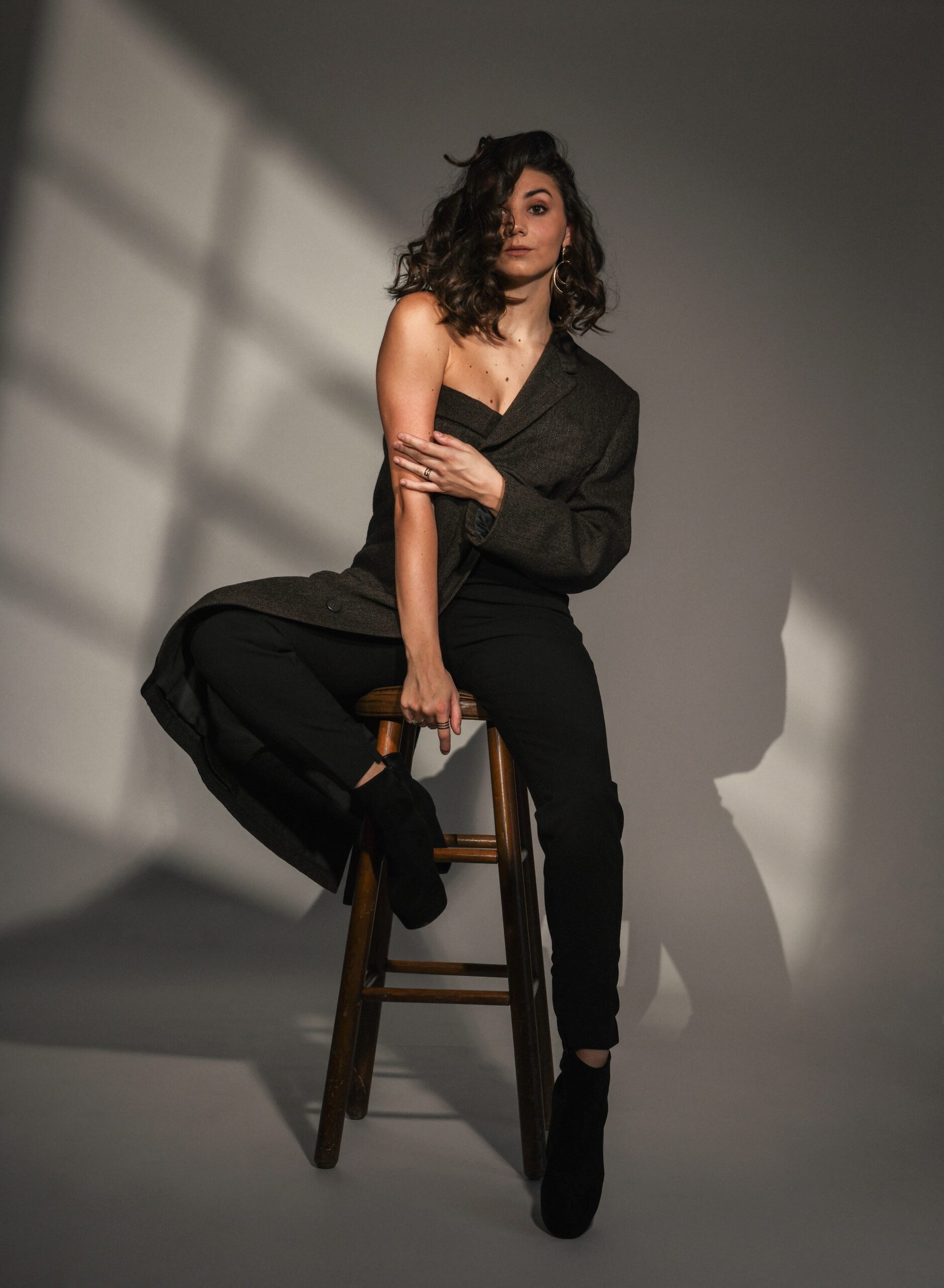 cassidy burel sitting on a chair in a custom jacket