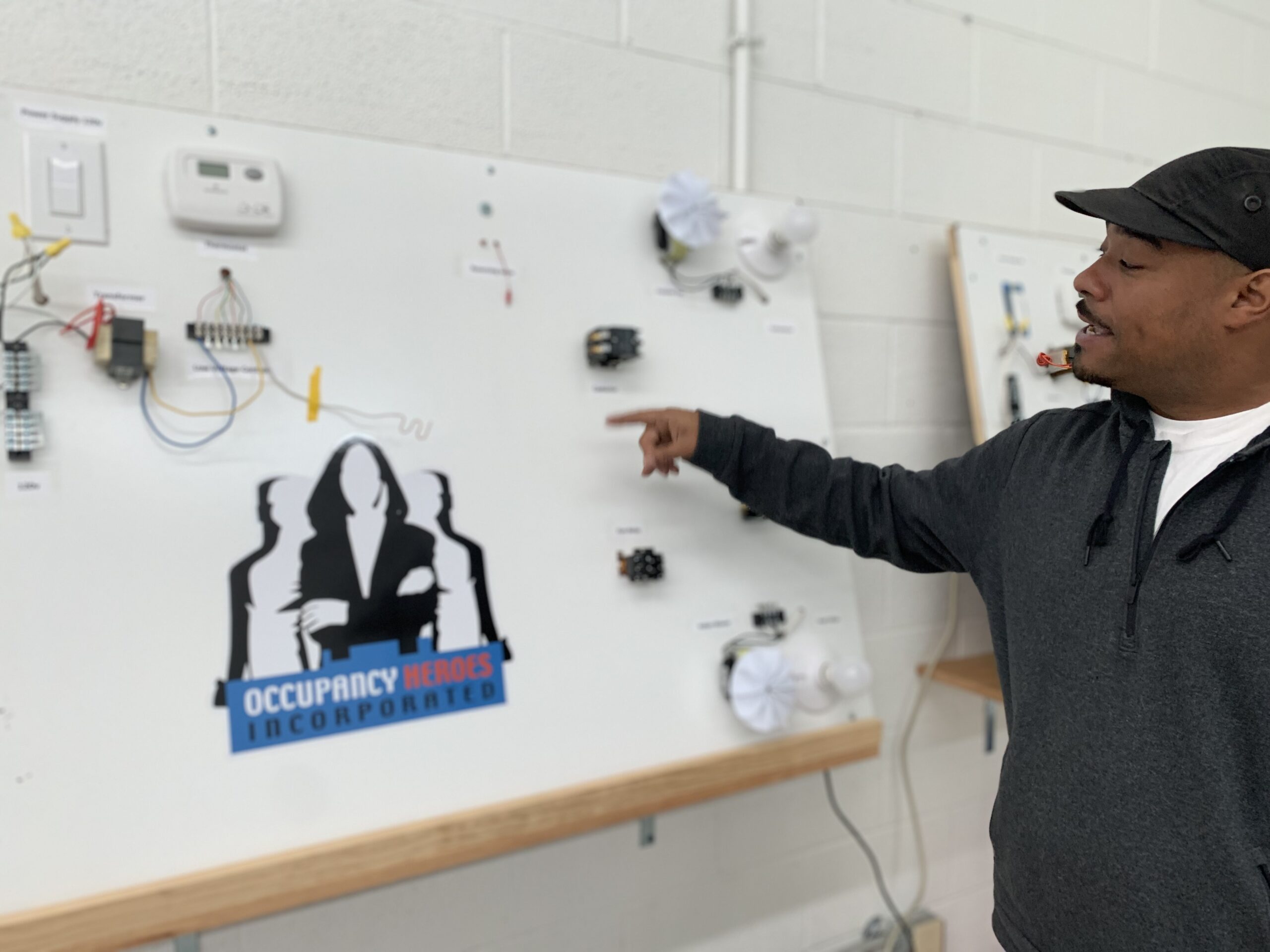 Russell Moore Pointing to an HVAC diagram